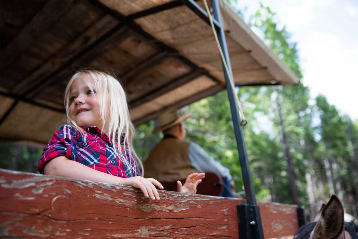 Close up of a young girl smiling at our California dude ranch