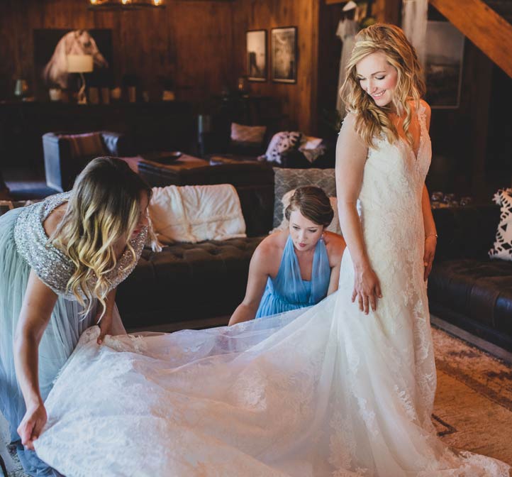 A bride in the dressing room preparing for her rustic wedding at Greenhorn Ranch
