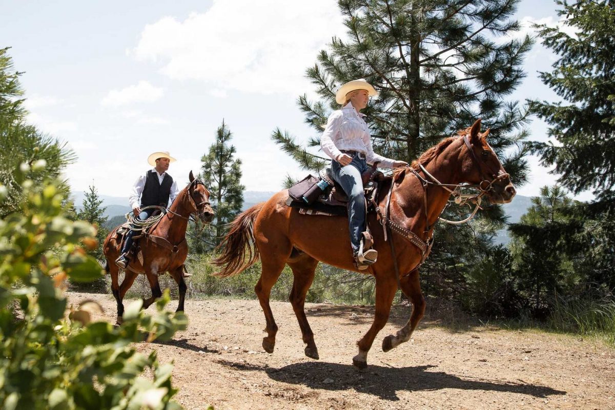 Riding horseback through the pine trees at Greenhorn Ranch