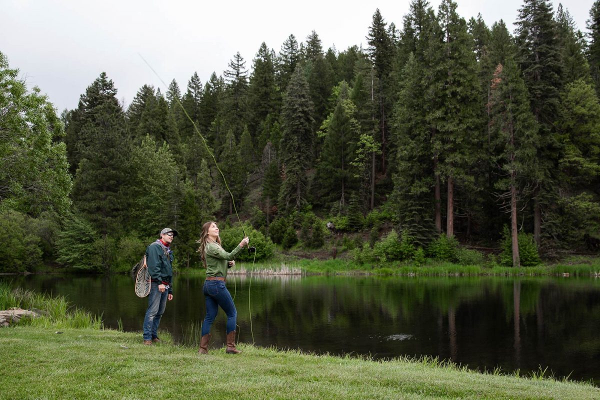 A guest learning to fly-fish with our guide