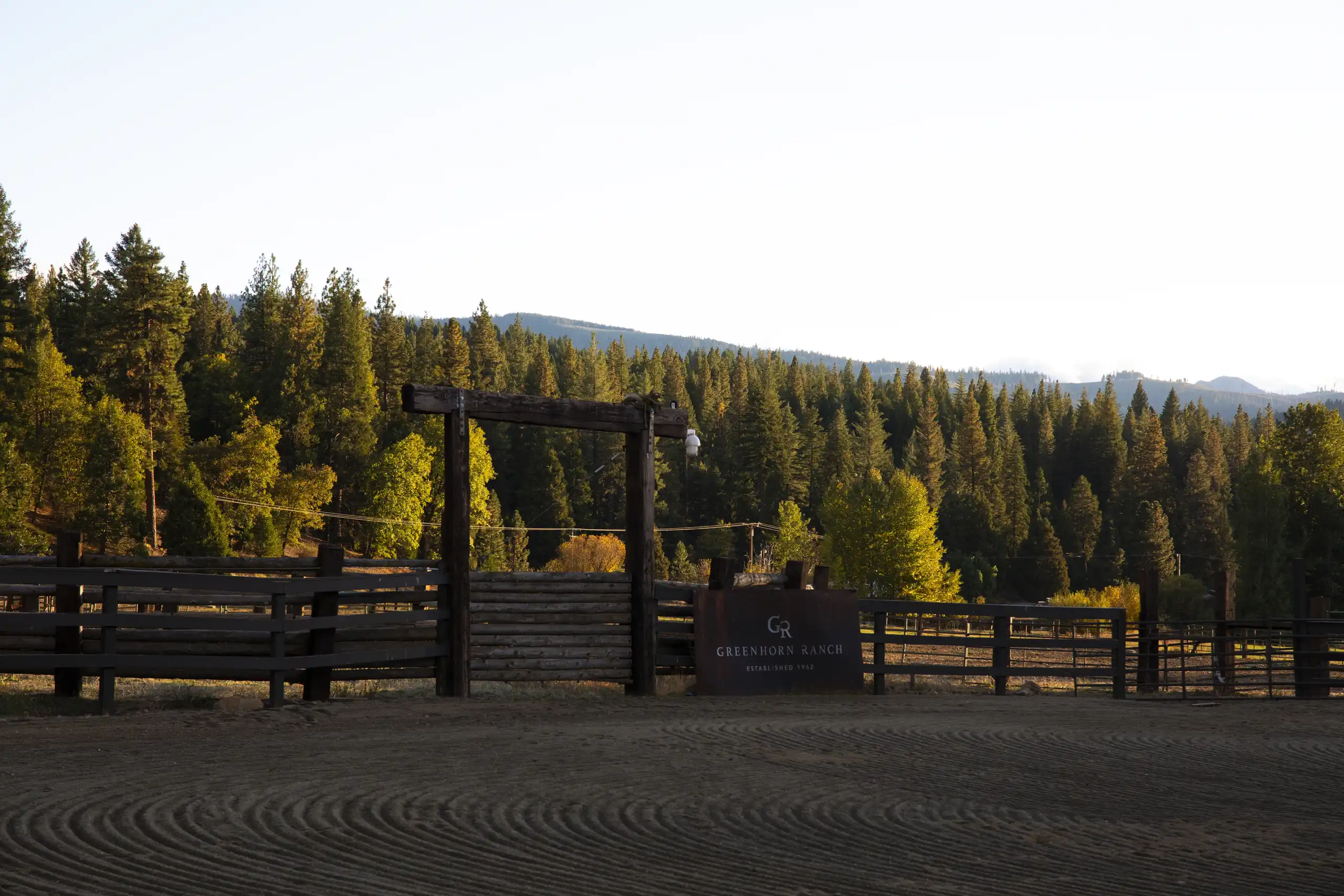 greenhorn-ranch-property-03 Entrance to Greenhorn Ranch corral with scenic mountain views and rustic ranch fencing