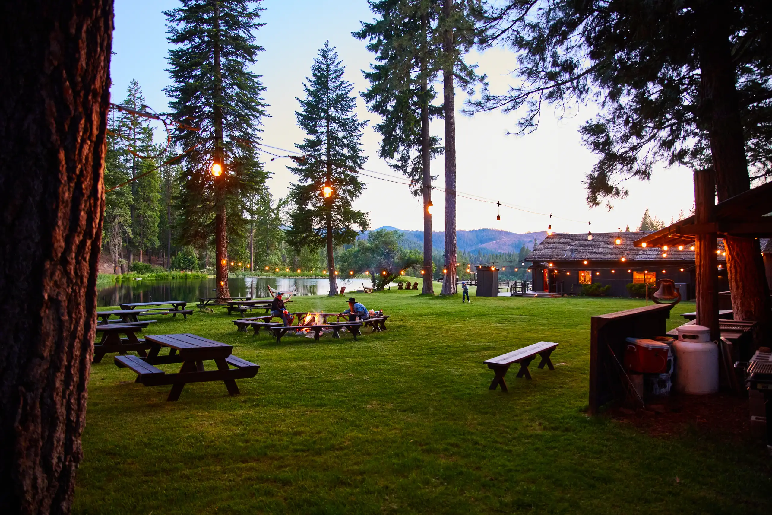 greenhorn-ranch-property-08 Guests relaxing on the lawn near the saloon and picnic area at Greenhorn Ranch